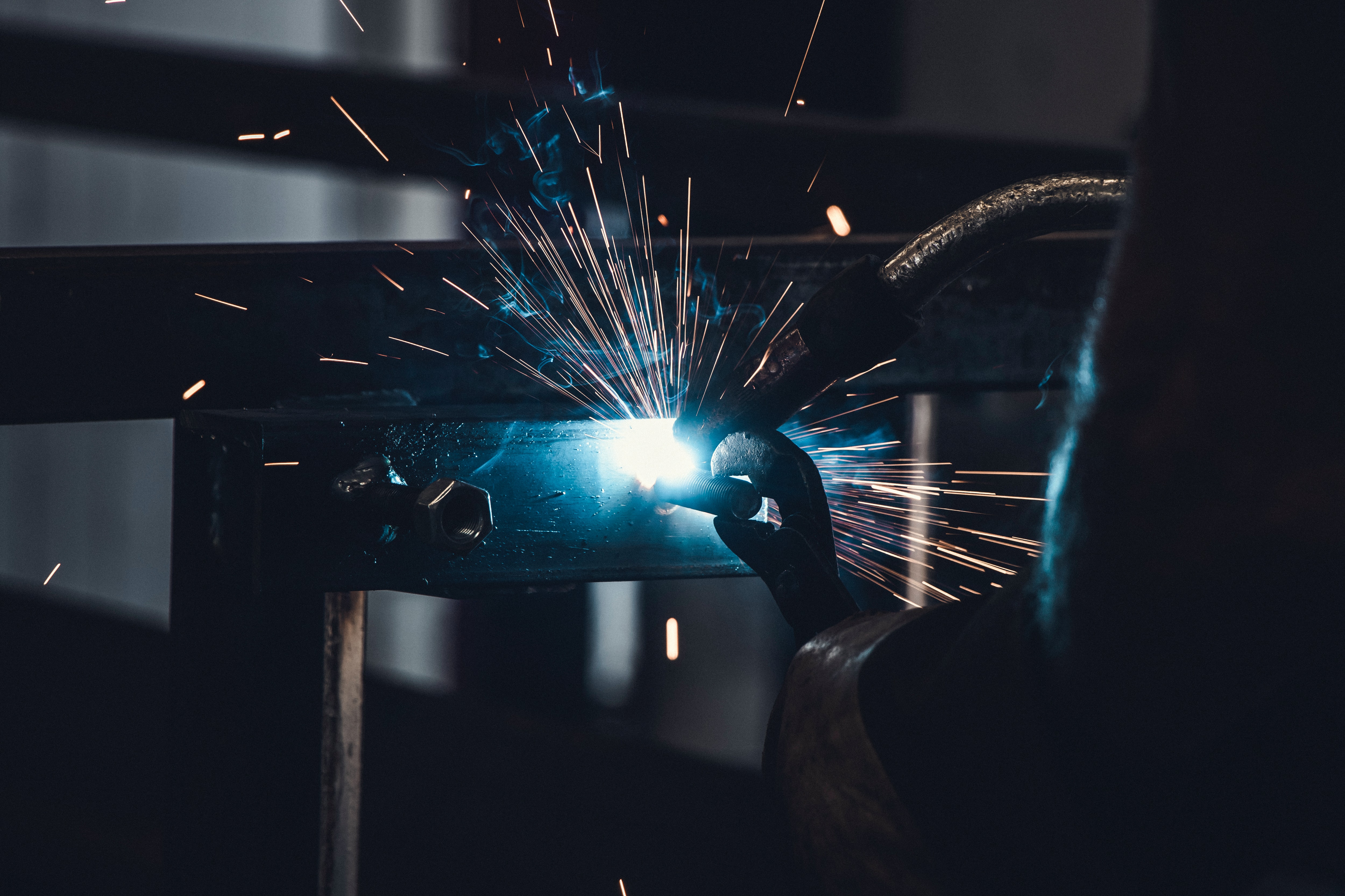 Engineer welding and creating sparks