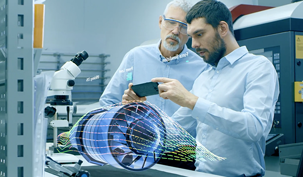 Two colleagues working together using AR